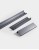 Szare aluminiowe uchwyty krawędziowe Lonia ułożone równolegle na jasnym tle, styl modern i minimalistyczny