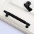 Uchwyt meblowy Montana czarny / złoty – radełkowany T-Bar industrialny 128 mm / 160 mm – sklep euchwyty.pl