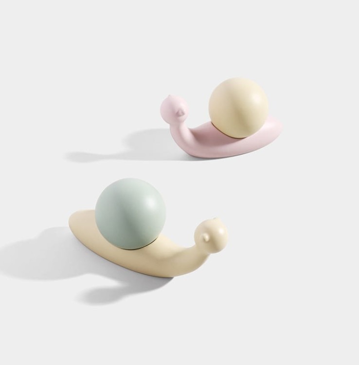 KinderMöbelgriff Caracol in Schneckenform. Pastellrosa oder Pastellgrün schmückt Schränke, Kommoden und Schubladen im Kinderzimmer und verbindet praktische Funktion mit kreativer, moderner Dekoration.