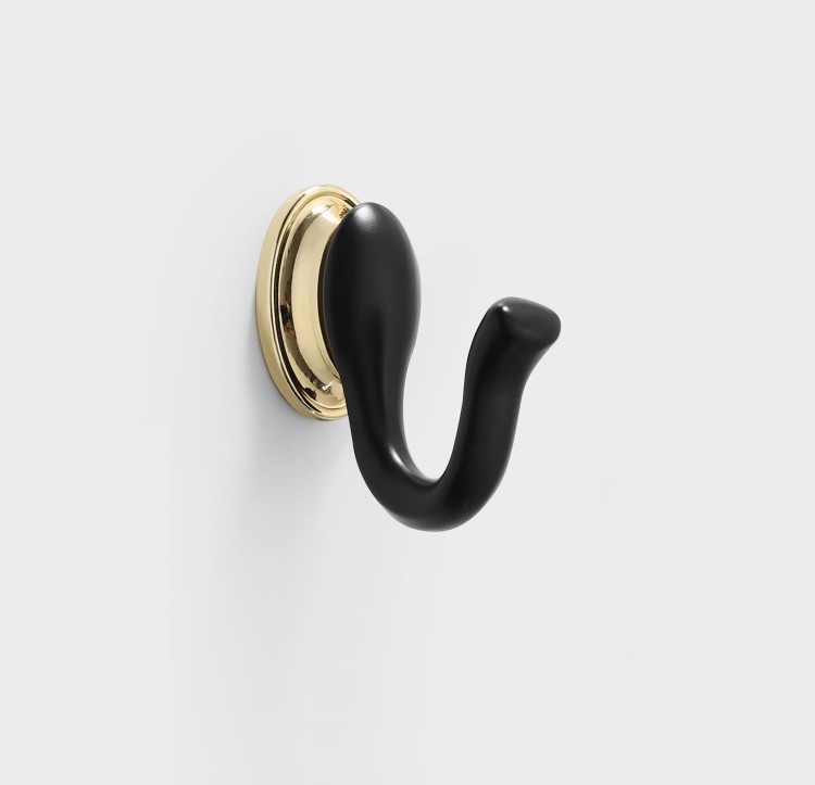Wandhaken Tunas mit designerischer, geschwungener Form. Robust, feuchtigkeitsbeständig und leicht zu montieren, Schrauben im Set. Ideal für Bad, Küche, Garderobe und Büro. Farben: Metallicgrau, Gold und Schwarz-Gold.
