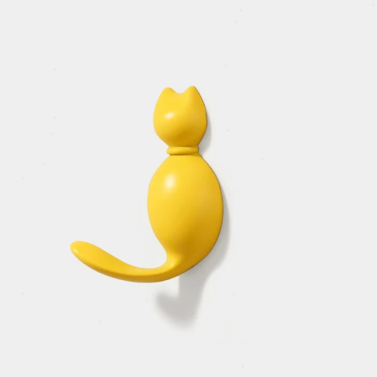 Żółty wieszak ścienny Gatito w kształcie kotka, radosny akcent kolorystyczny do przedpokoju i pokoju malucha