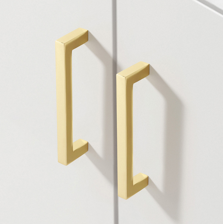 Möbelgriff Tinaja – moderner minimalistischer Griff als Knopf oder Leiste in 128 und 320 mm. Sieben trendige Farben von Weiß und Schwarz bis Gold und Grau. Ideal für Küche, Bad, Schränke und Kommoden.